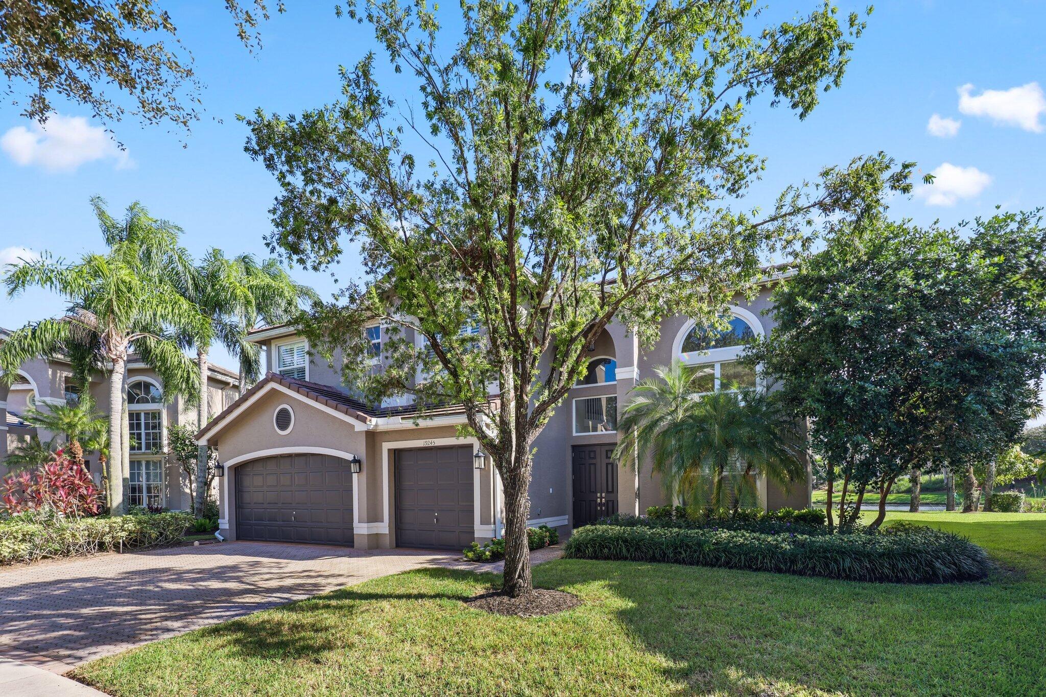 19245 Skyridge Circle Boca Raton, FL 33498 - Photo 4 of 70 front view of a house with a yard