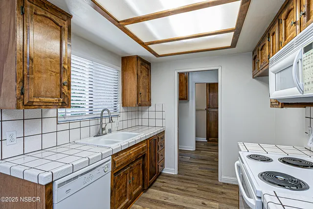 a kitchen with a stove and a sink