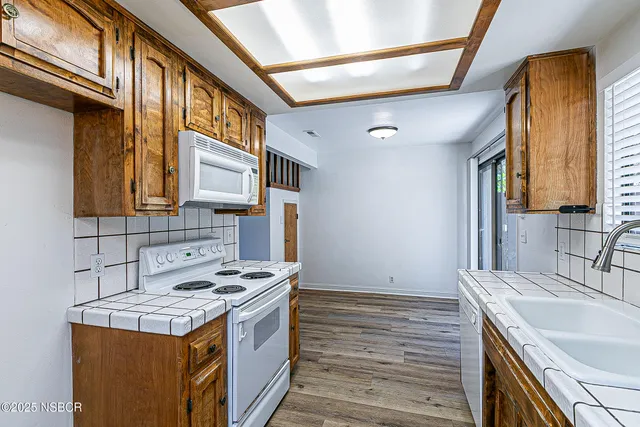 a kitchen with a stove and a sink