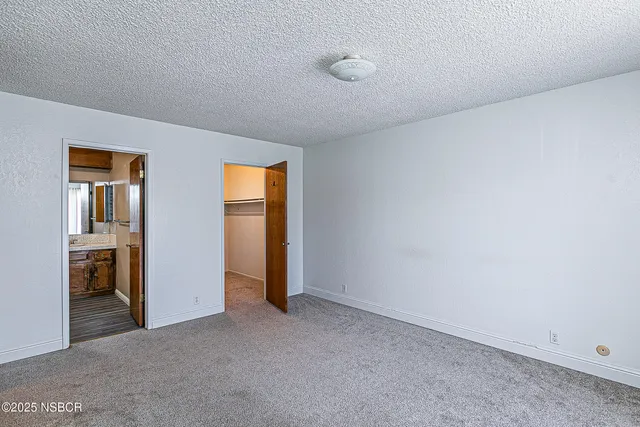 a view of an empty room and fire place
