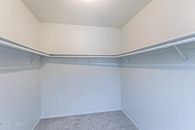 a view of an empty walk in closet