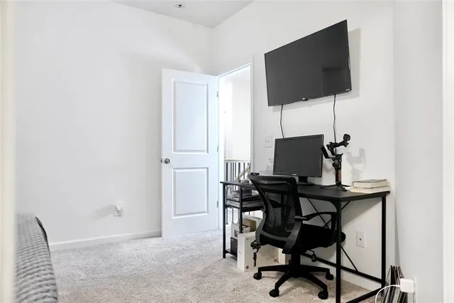 a view of a workspace with furniture