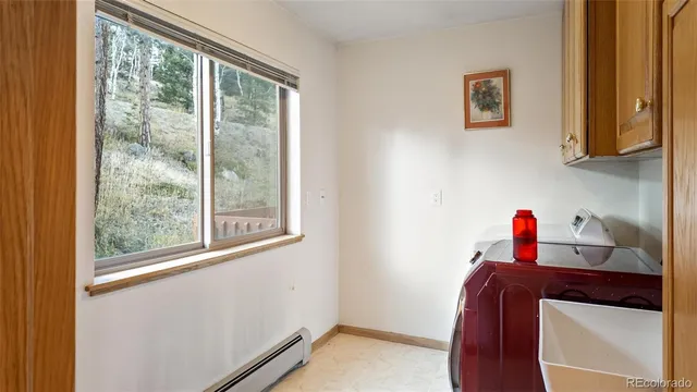 a hallway with a view of bedroom with a window