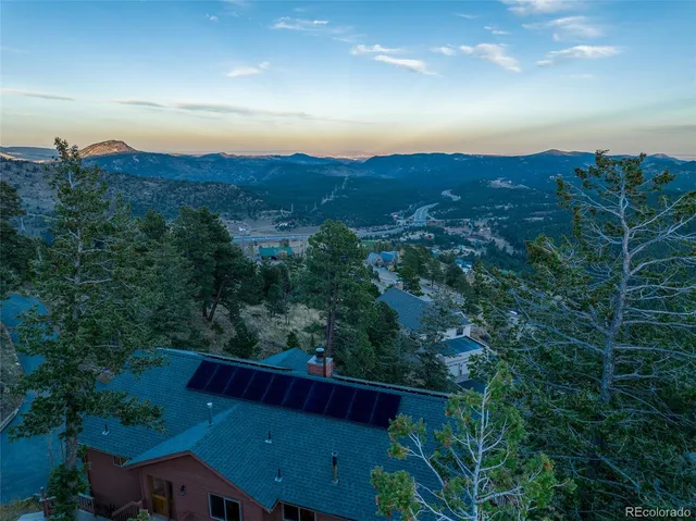an aerial view of residential house and outdoor space
