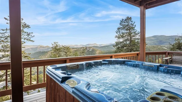 a view of roof deck with furniture