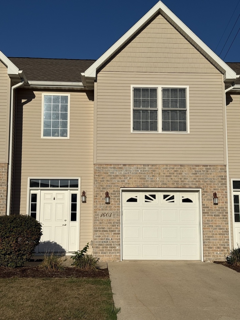 1603 Riverside Circle Dixon, IL 61021 - Photo 1 of 20 a front view of a house with a garage