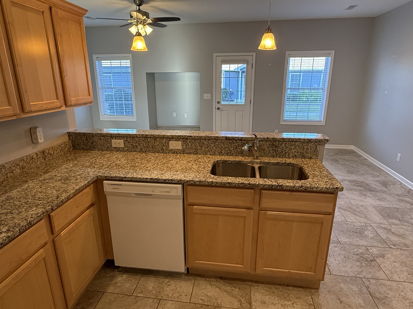 1603 Riverside Circle Dixon, IL 61021 - Photo 6 of 20 a kitchen with granite countertop a sink and a stove