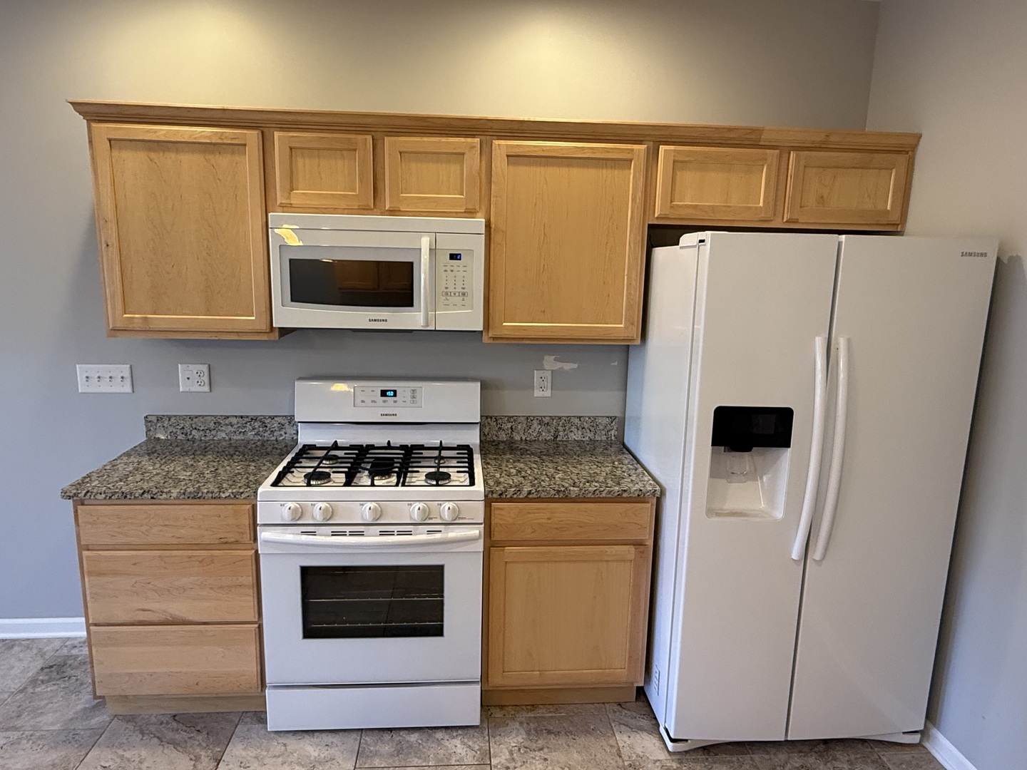 1603 Riverside Circle Dixon, IL 61021 - Photo 7 of 20 a kitchen with white cabinets and white appliances