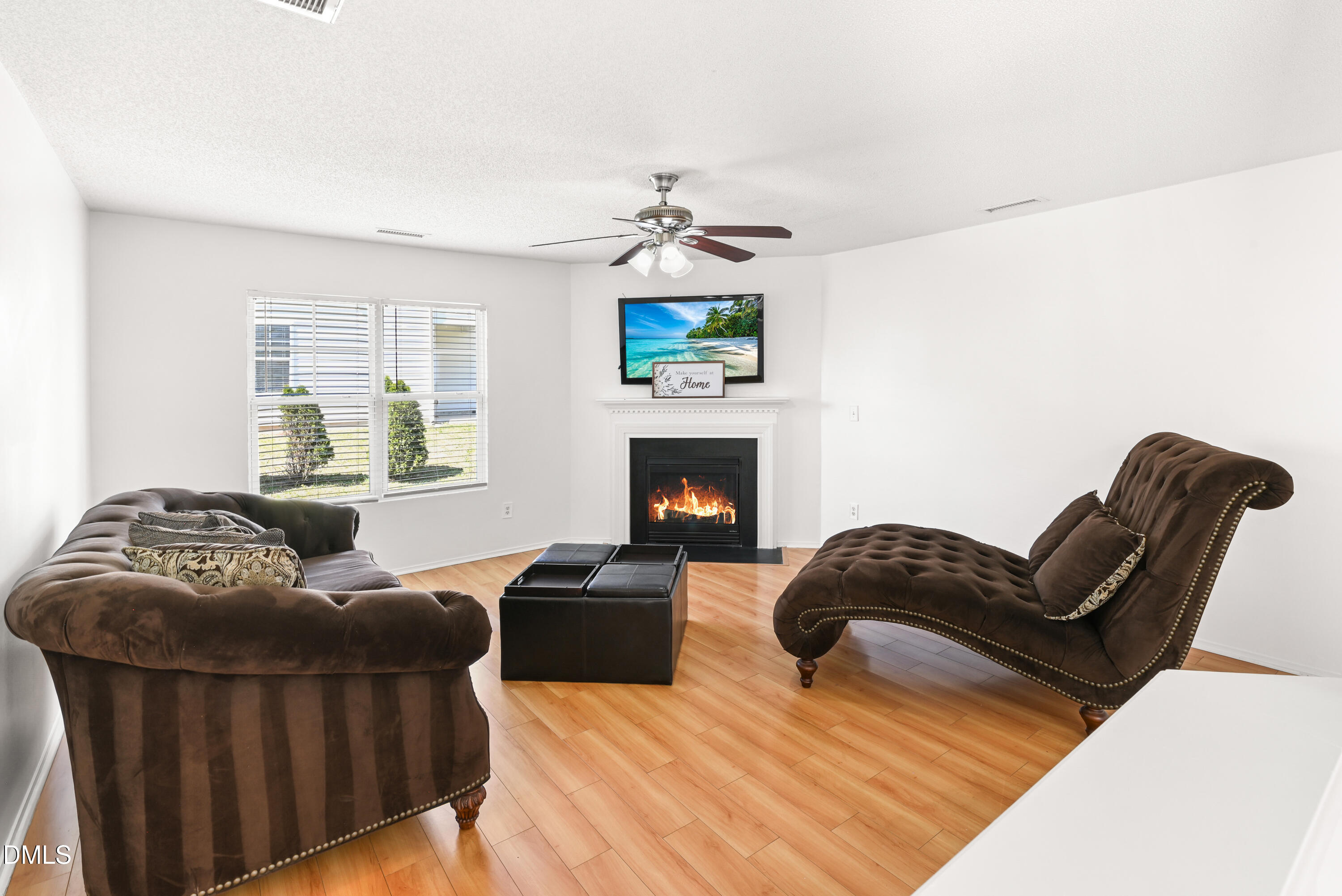1012 Naylor Road Knightdale, NC 27545 - Photo 11 of 33 a living room with furniture and a fireplace