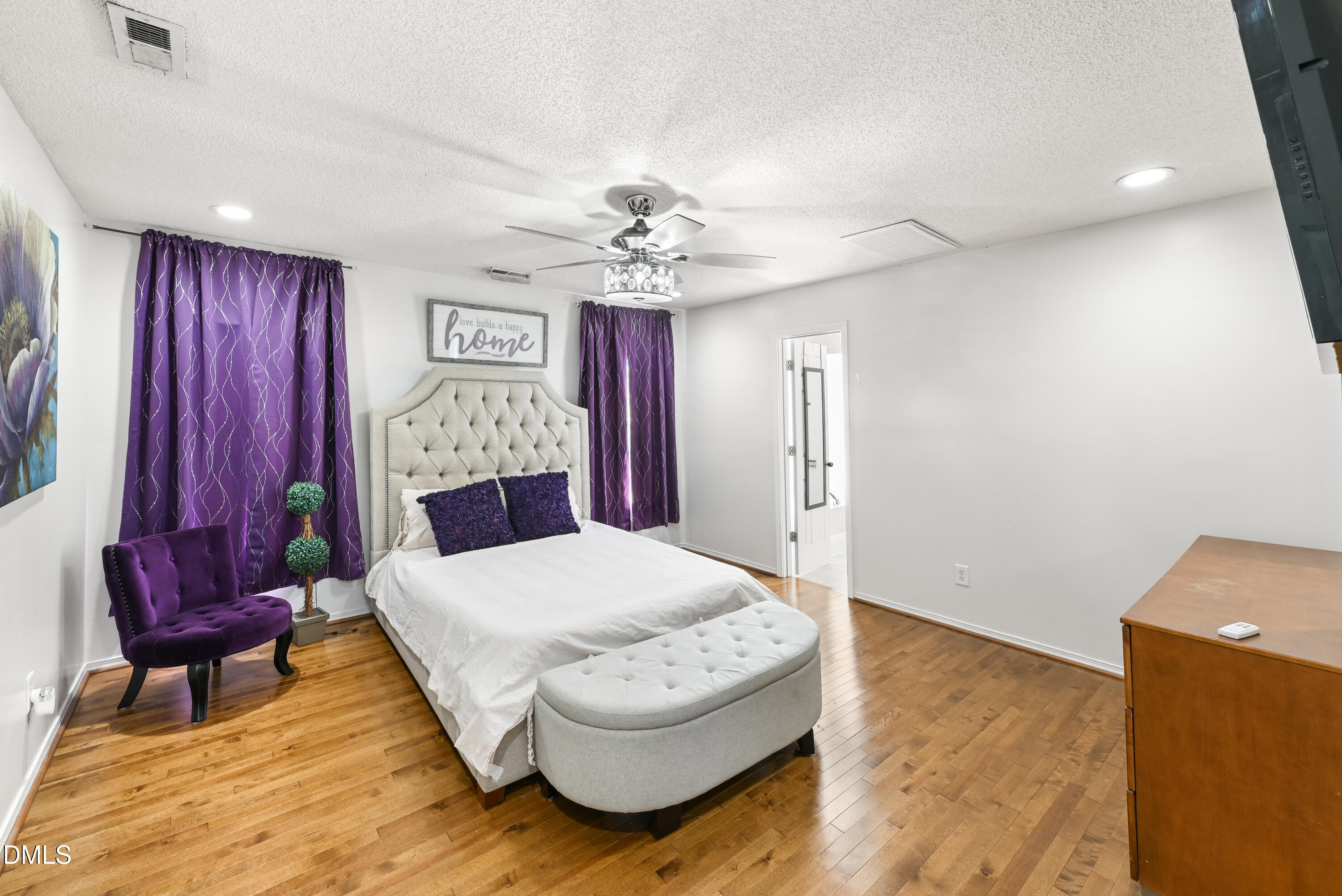 1012 Naylor Road Knightdale, NC 27545 - Photo 13 of 33 a living room with a couch and chandelier