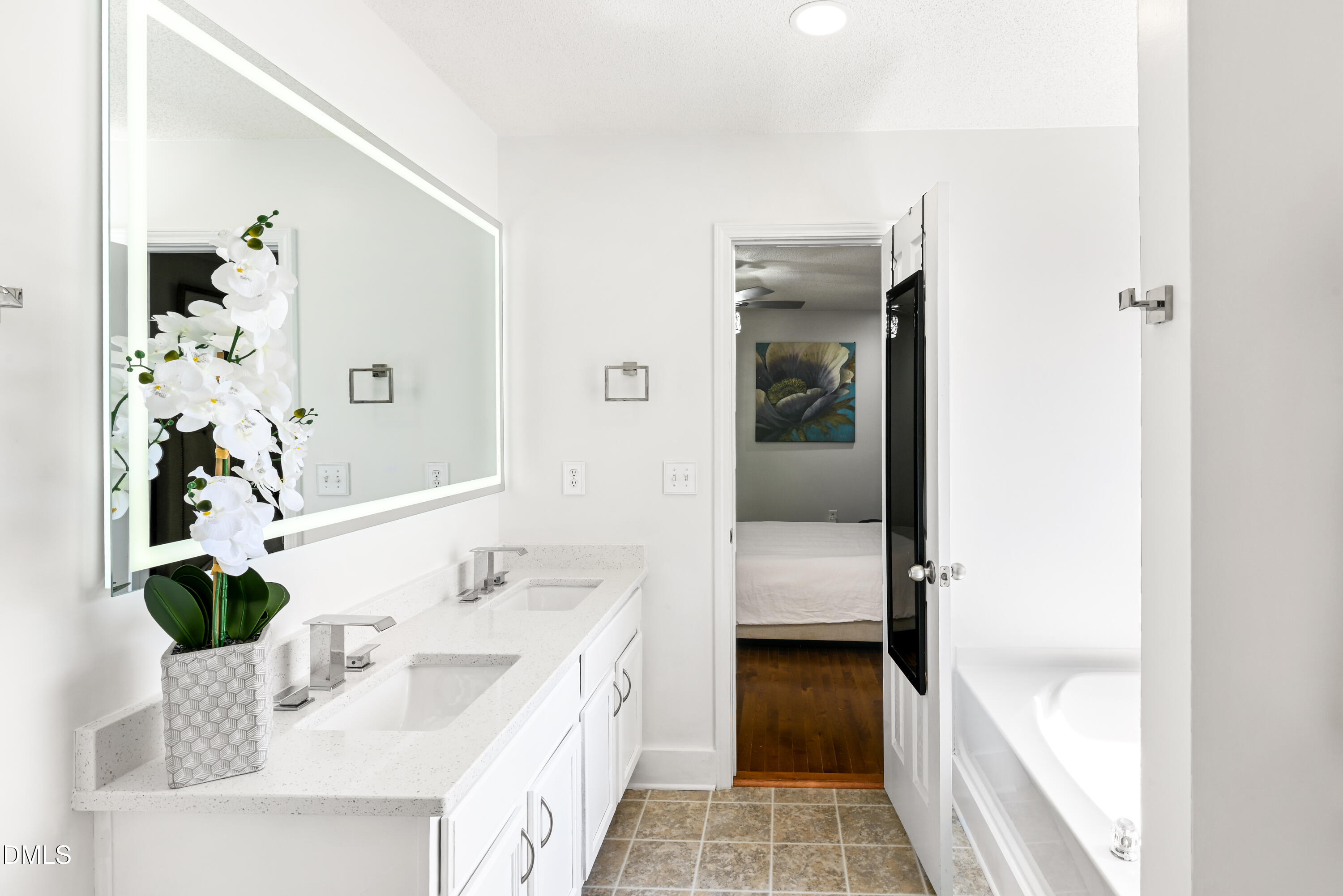 1012 Naylor Road Knightdale, NC 27545 - Photo 17 of 33 a en suite bathroom with a double vanity sink and a mirror