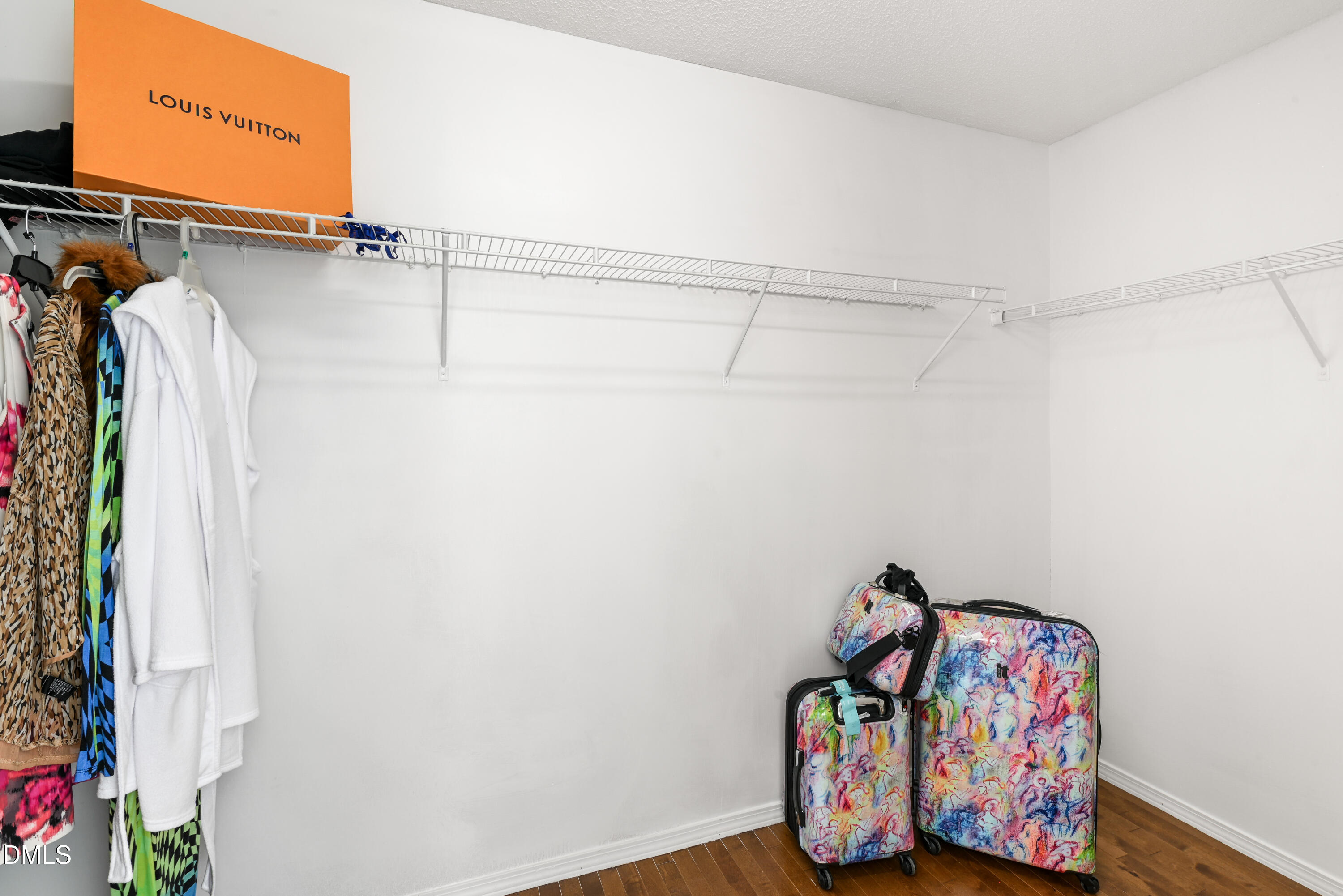 1012 Naylor Road Knightdale, NC 27545 - Photo 18 of 33 a view of walk in closet with clothes and shoes