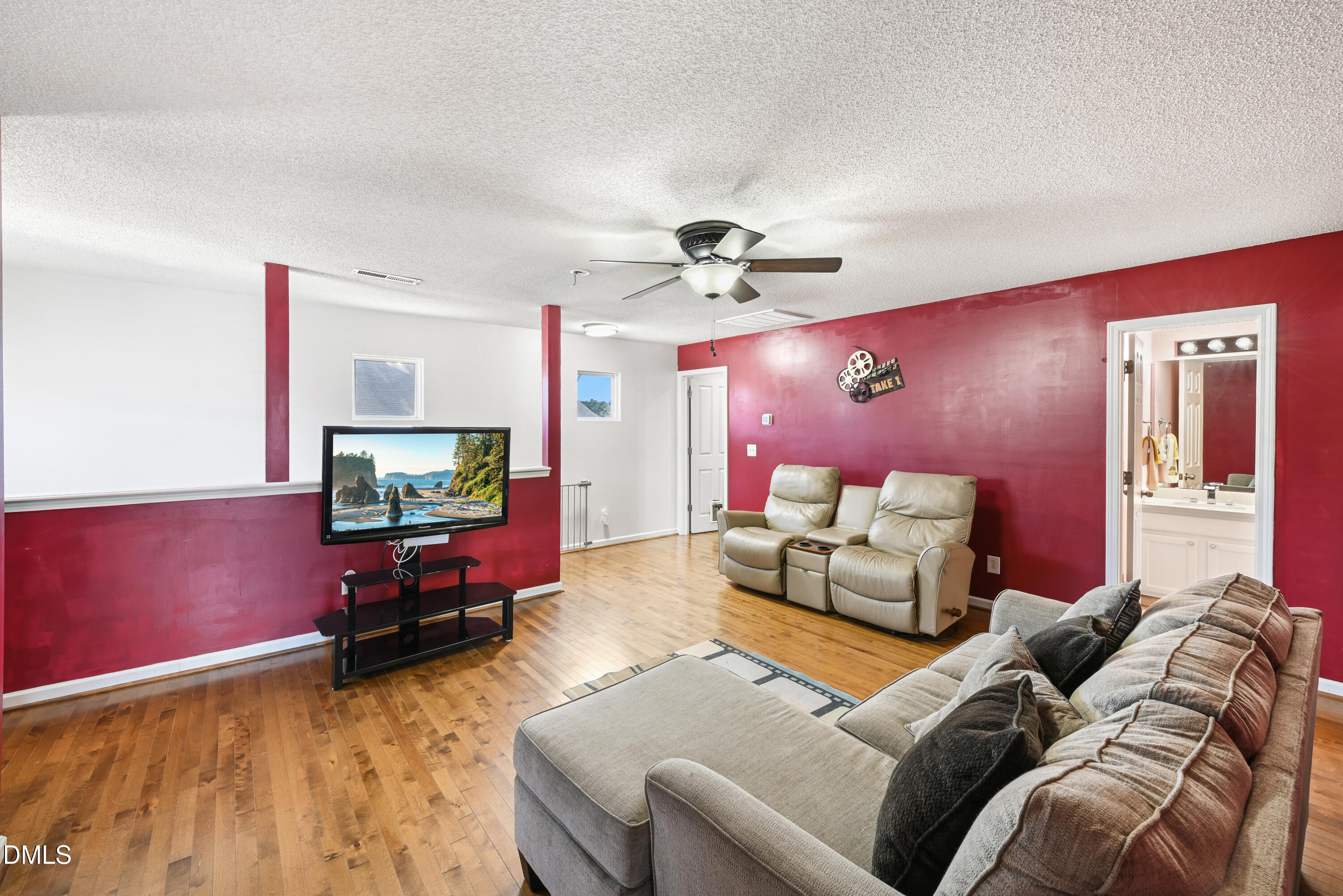 1012 Naylor Road Knightdale, NC 27545 - Photo 22 of 33 a living room with furniture and a flat screen tv