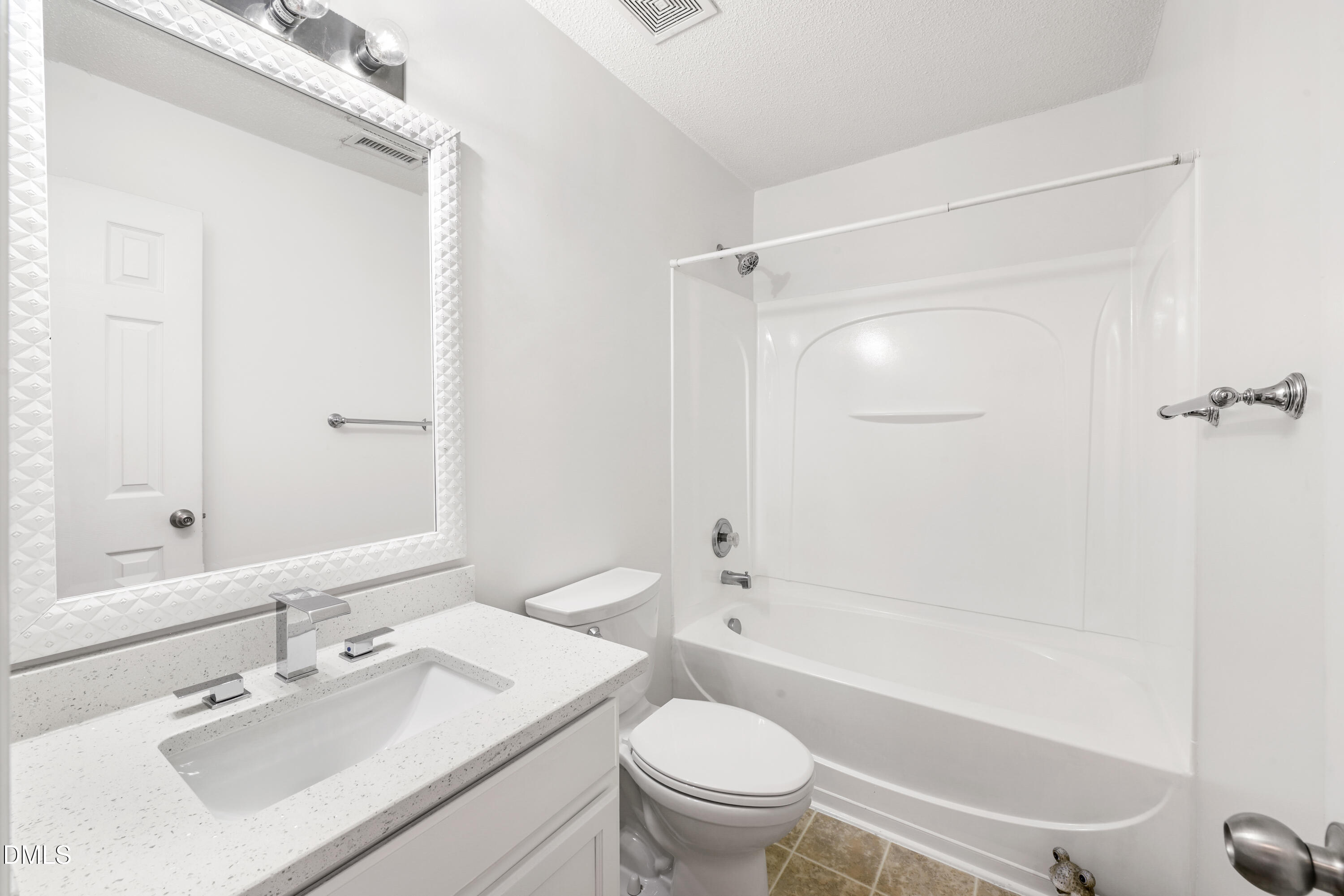 1012 Naylor Road Knightdale, NC 27545 - Photo 25 of 33 a bathroom with a sink toilet and shower