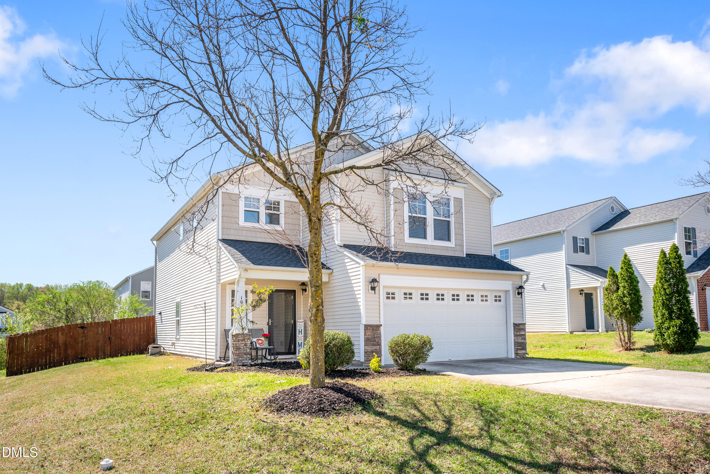 1012 Naylor Road Knightdale, NC 27545 - Photo 3 of 33 a view of a house with a yard and large tree