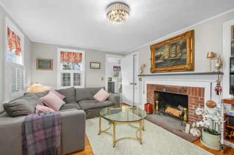 a living room with furniture or couch and a flat screen tv