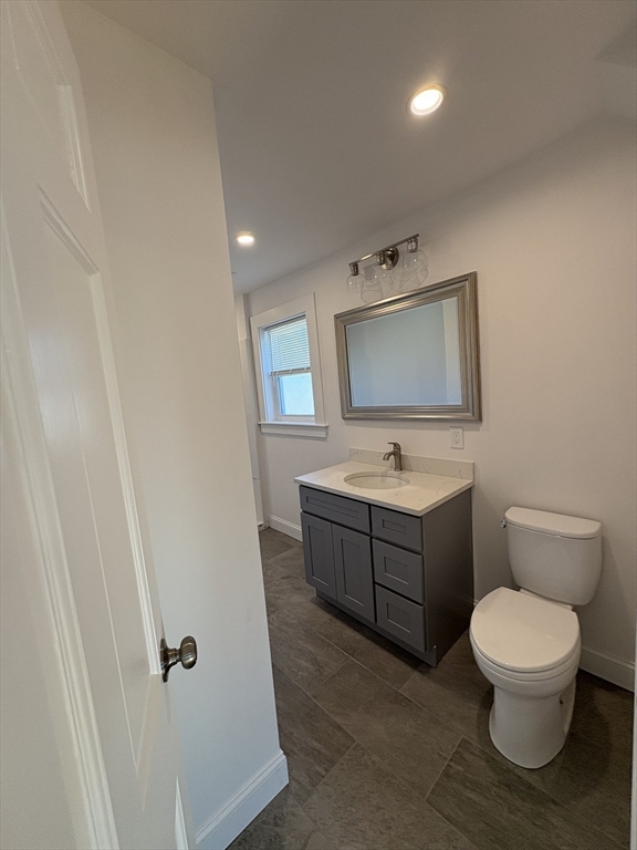 47 Marsh Road Needham, MA 02492 - Photo 20 of 20 a bathroom with a toilet sink and mirror