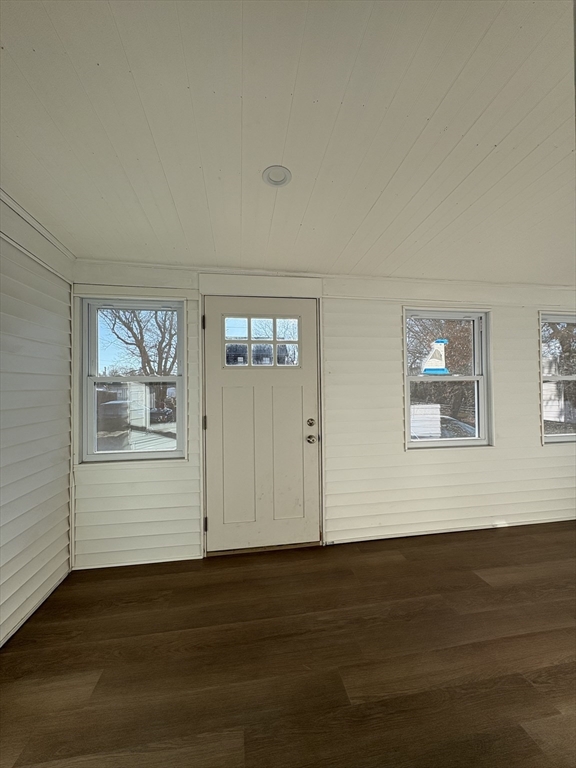 47 Marsh Road Needham, MA 02492 - Photo 3 of 20 a view of an empty room with wooden floor and a window