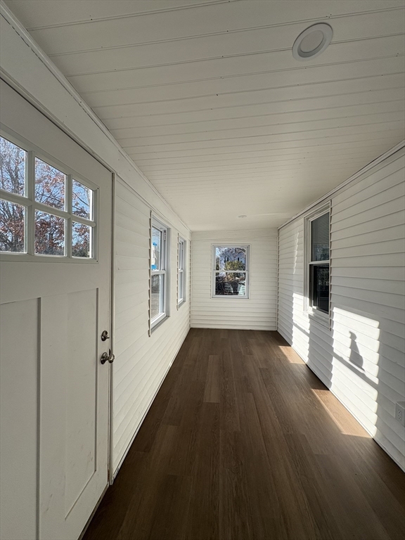 47 Marsh Road Needham, MA 02492 - Photo 4 of 20 a view of a hallway with wooden floor and a living room