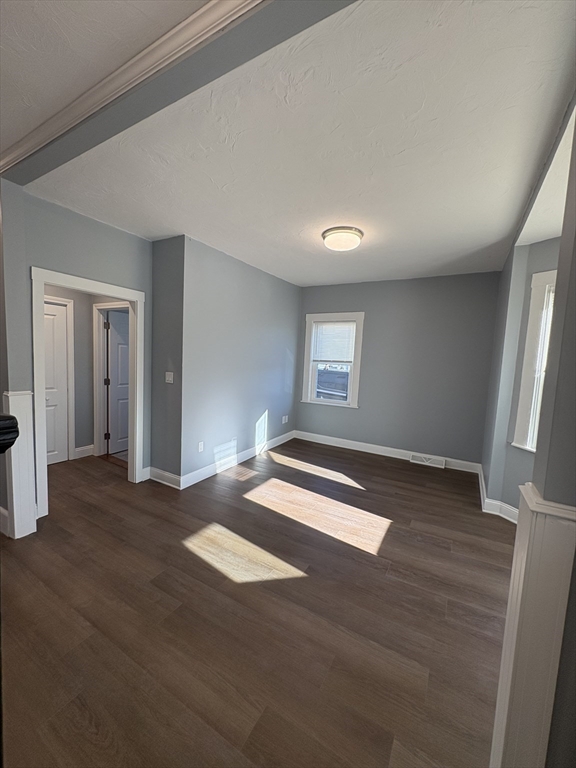 47 Marsh Road Needham, MA 02492 - Photo 5 of 20 a view of empty room with wooden floor and fan