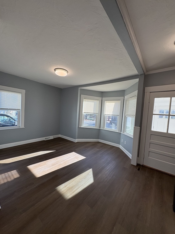 47 Marsh Road Needham, MA 02492 - Photo 6 of 20 a view of an empty room with wooden floor and a window