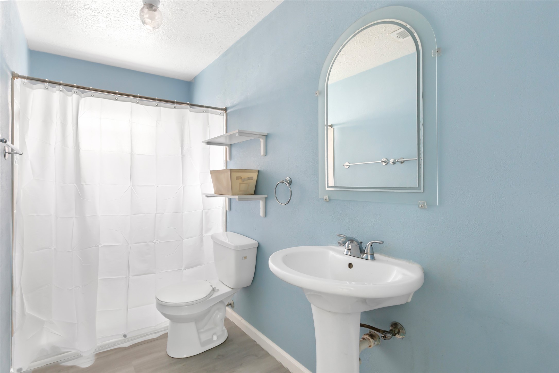 8315 Old Maple Lane Humble, TX 77338 - Photo 17 of 19 Hall bath with walk-in shower and pedestal sink.