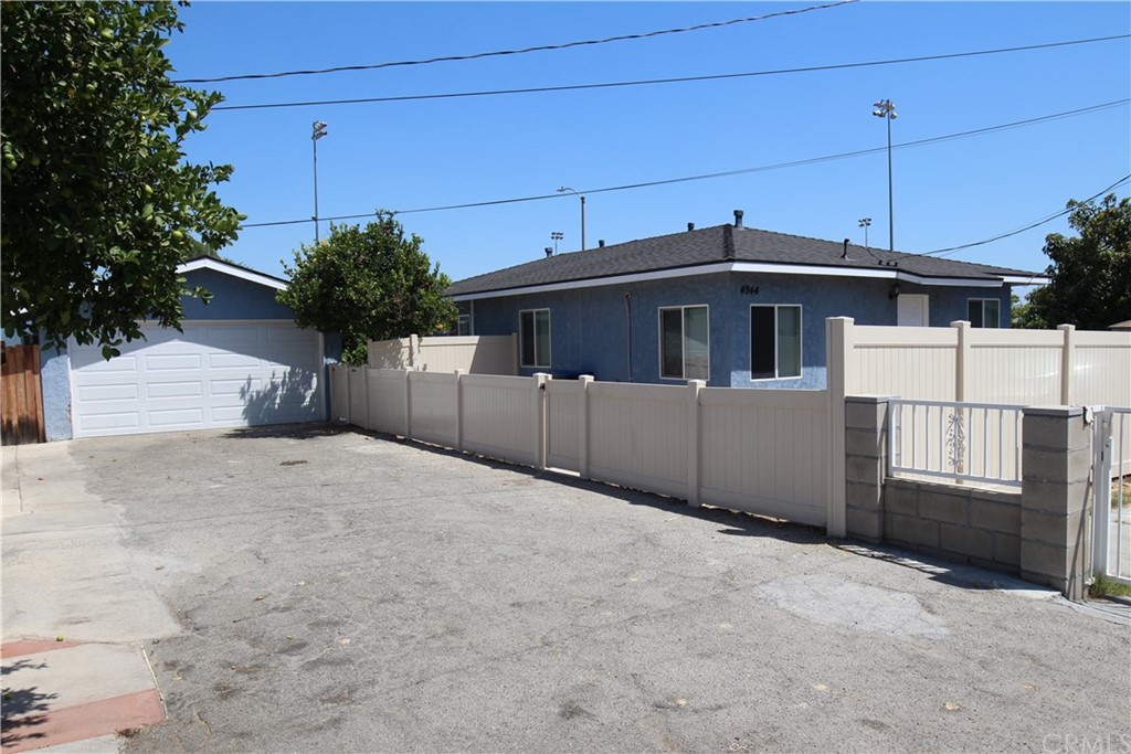 4944 Bleecker Street Baldwin Park, CA 91706 - Photo 1 of 11 a view of a house with a garage