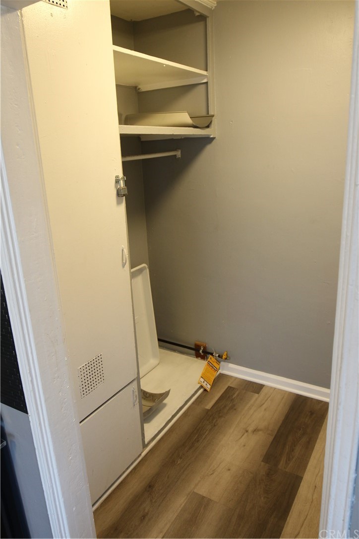 4944 Bleecker Street Baldwin Park, CA 91706 - Photo 7 of 11 a bathroom with a granite countertop sink and washing machine