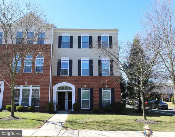 a front view of a building with garden