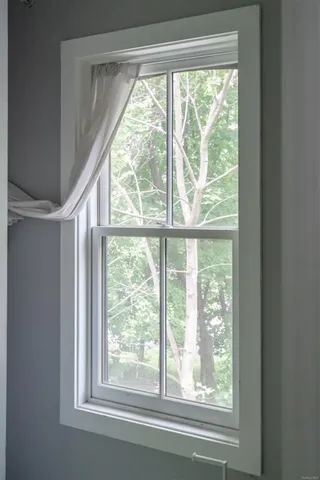 a view of a room that has a large window
