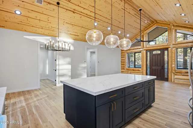 a kitchen with a stove a sink and a microwave