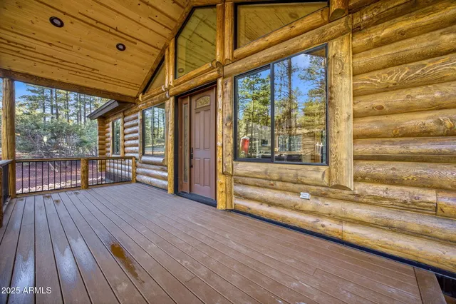 a view of outdoor space with wooden floor and stairs