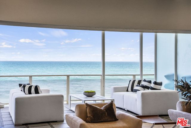 a view of a dry yard with wooden floor and fence