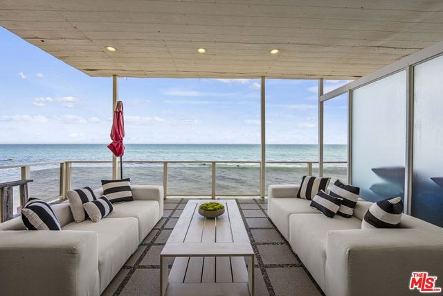 a view of living room with furniture and a table
