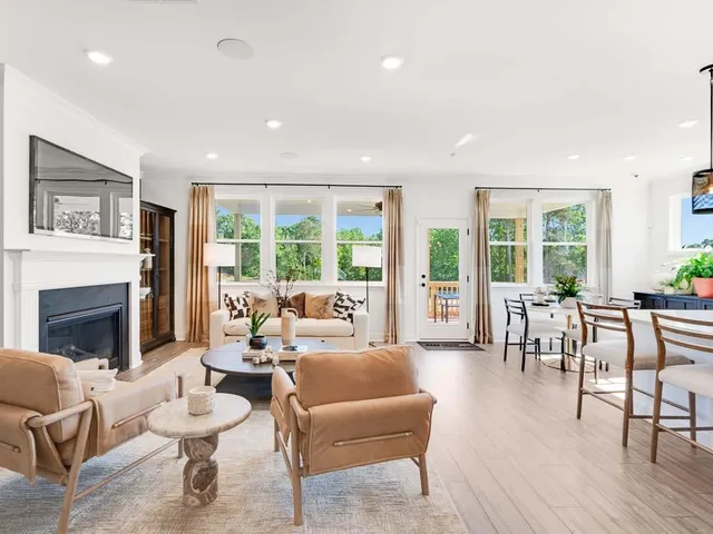 a kitchen with stainless steel appliances granite countertop a lot of counter space and wooden floors