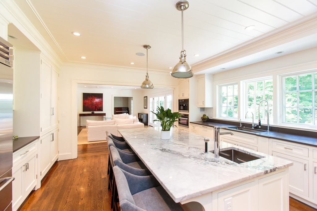 35 Hundreds Road Wellesley, MA 02481 - Photo 13 of 27 a kitchen with stainless steel appliances kitchen island granite countertop a sink and cabinets