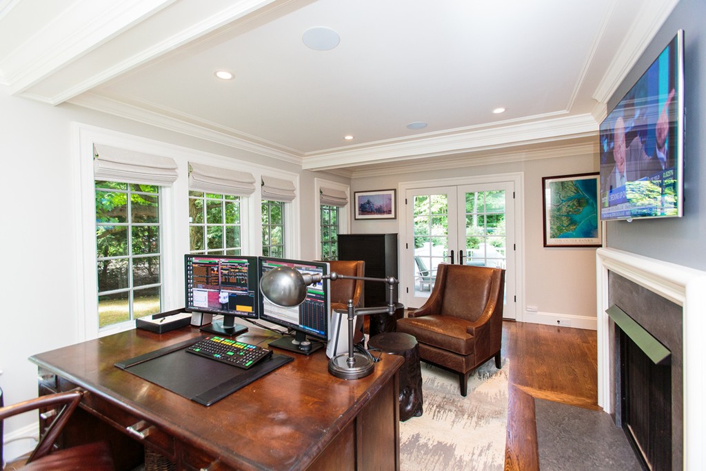 35 Hundreds Road Wellesley, MA 02481 - Photo 14 of 27 a living room with furniture flat screen tv and a fireplace