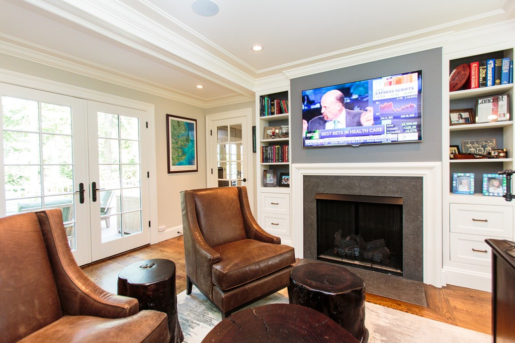 35 Hundreds Road Wellesley, MA 02481 - Photo 15 of 27 a living room with furniture a fireplace and a flat screen tv