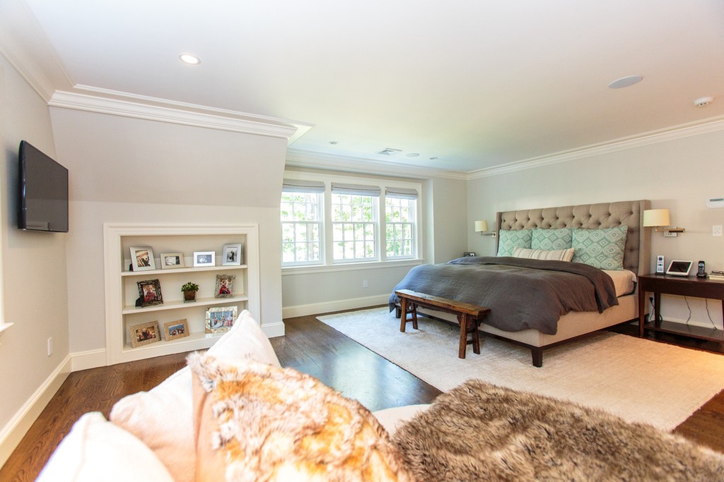 35 Hundreds Road Wellesley, MA 02481 - Photo 16 of 27 a bedroom with a bed and a flat screen television