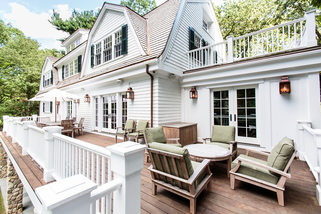 35 Hundreds Road Wellesley, MA 02481 - Photo 23 of 27 a view of a patio with couches table and chairs and wooden floor