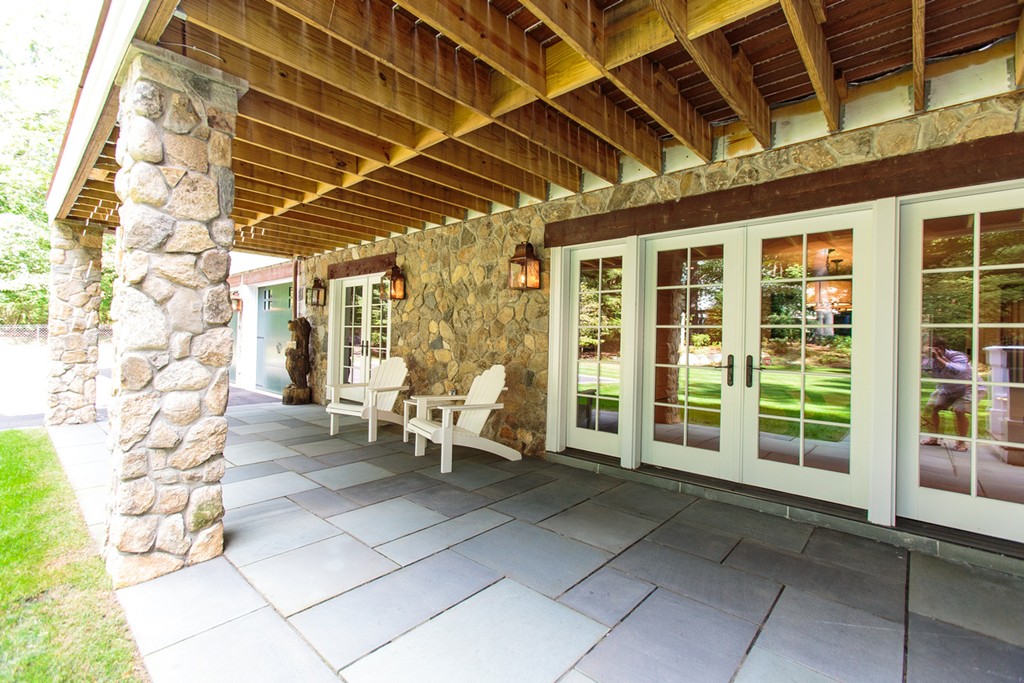 35 Hundreds Road Wellesley, MA 02481 - Photo 24 of 27 a view of a porch with chairs
