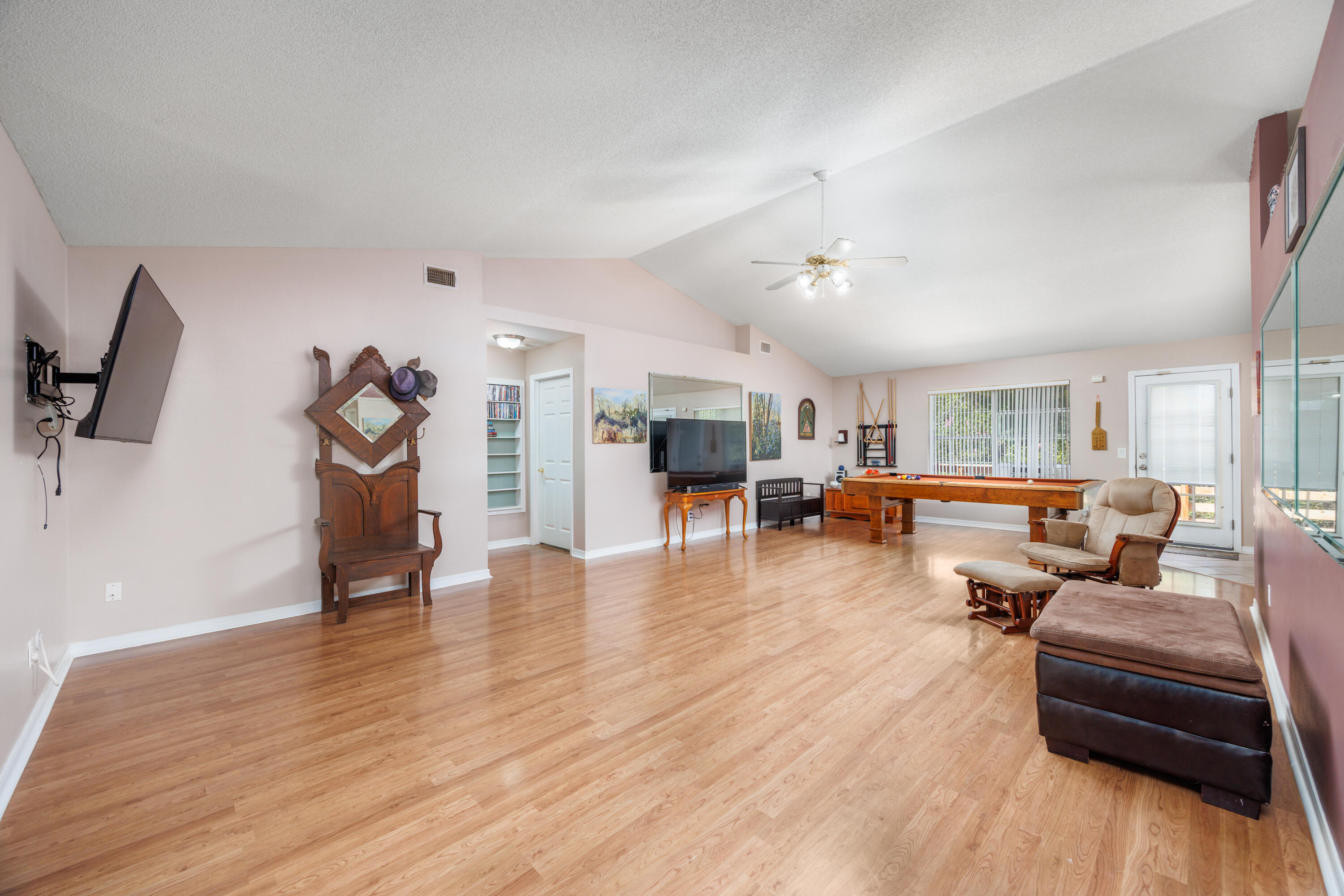 4860 Orlimar Street Crestview, FL 32536 - Photo 12 of 36 a living room with furniture and a wooden floor