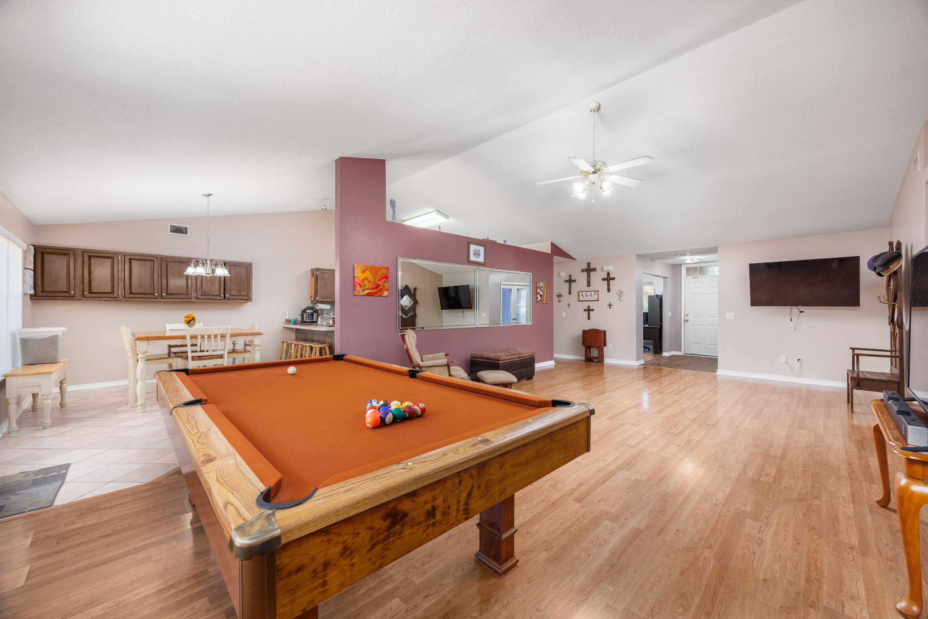 4860 Orlimar Street Crestview, FL 32536 - Photo 14 of 36 a room with furniture pool table flat screen tv and wooden floor