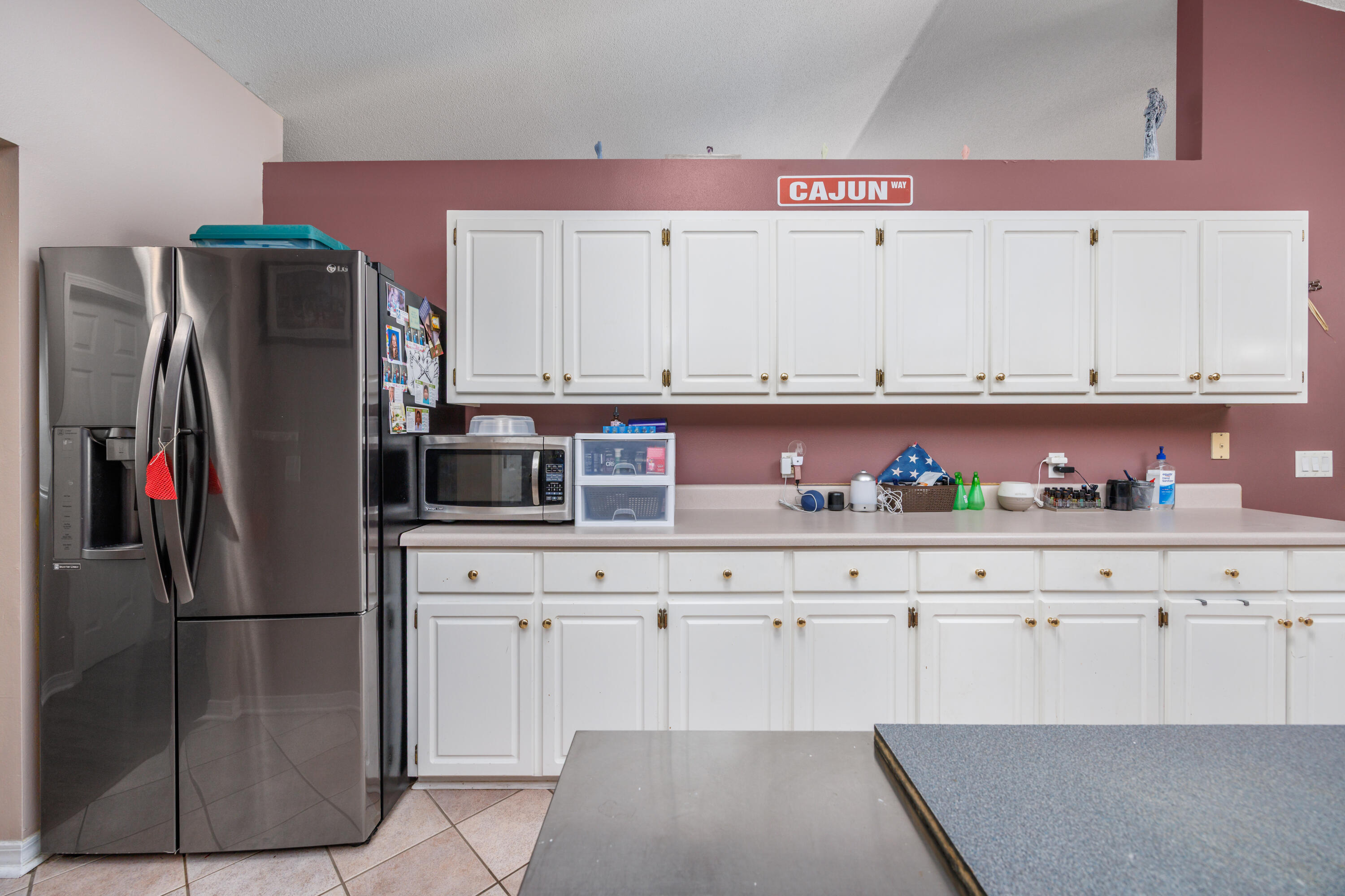 4860 Orlimar Street Crestview, FL 32536 - Photo 17 of 36 a kitchen with stainless steel appliances granite countertop a refrigerator and a stove top oven