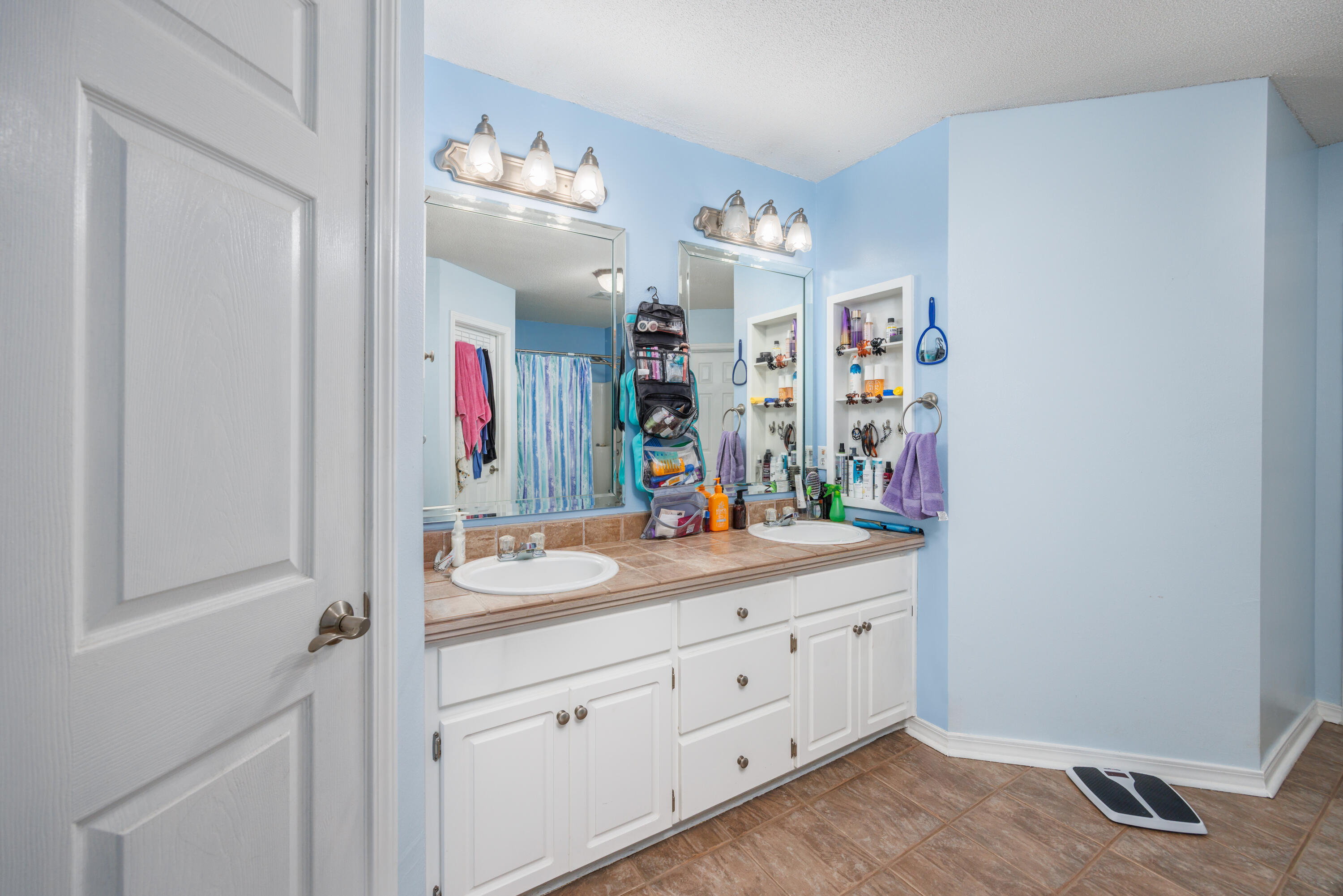4860 Orlimar Street Crestview, FL 32536 - Photo 21 of 36 a bathroom with a sink a vanity and a mirror
