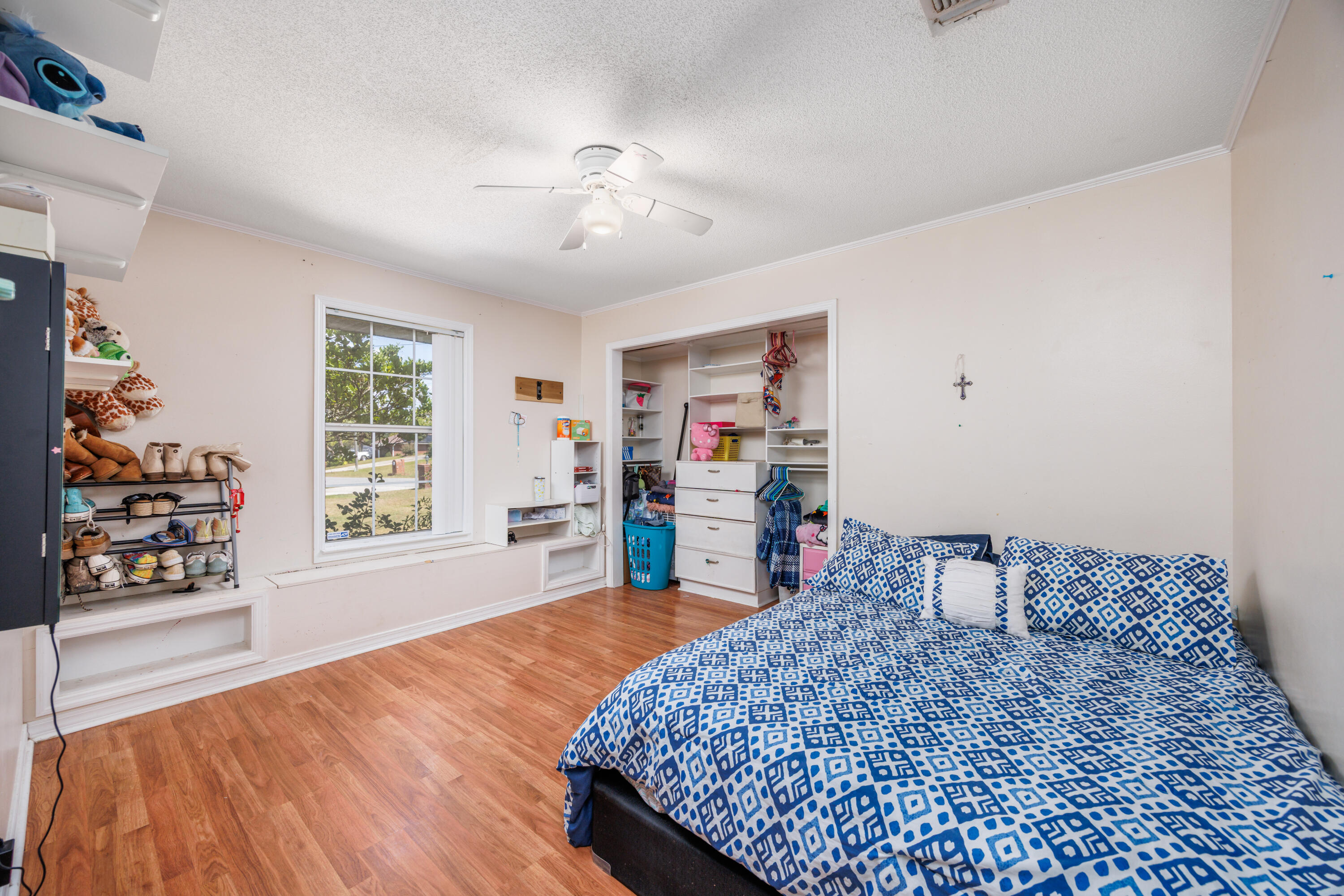 4860 Orlimar Street Crestview, FL 32536 - Photo 29 of 36 a living room with furniture and a wooden floor