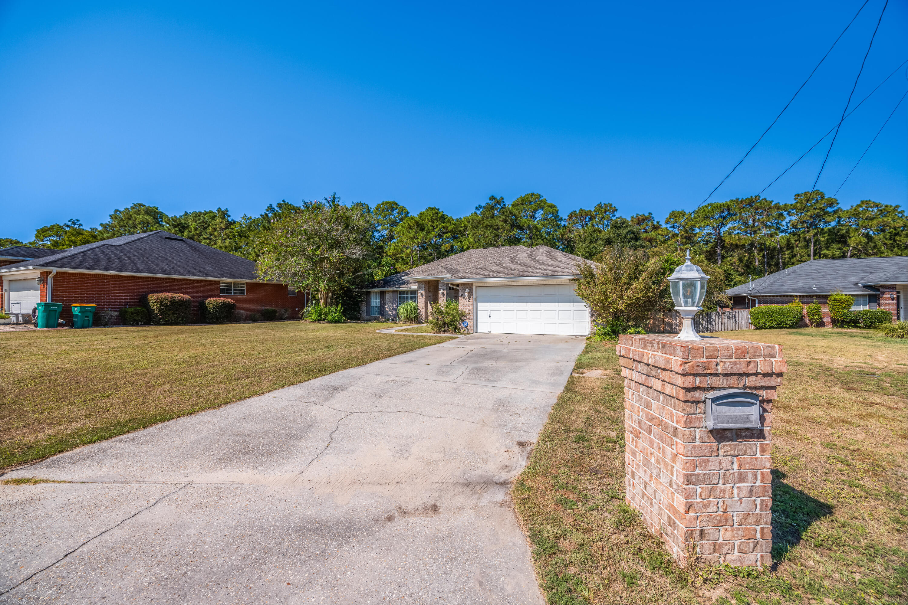 4860 Orlimar Street Crestview, FL 32536 - Photo 3 of 36 a front view of a house with a yard