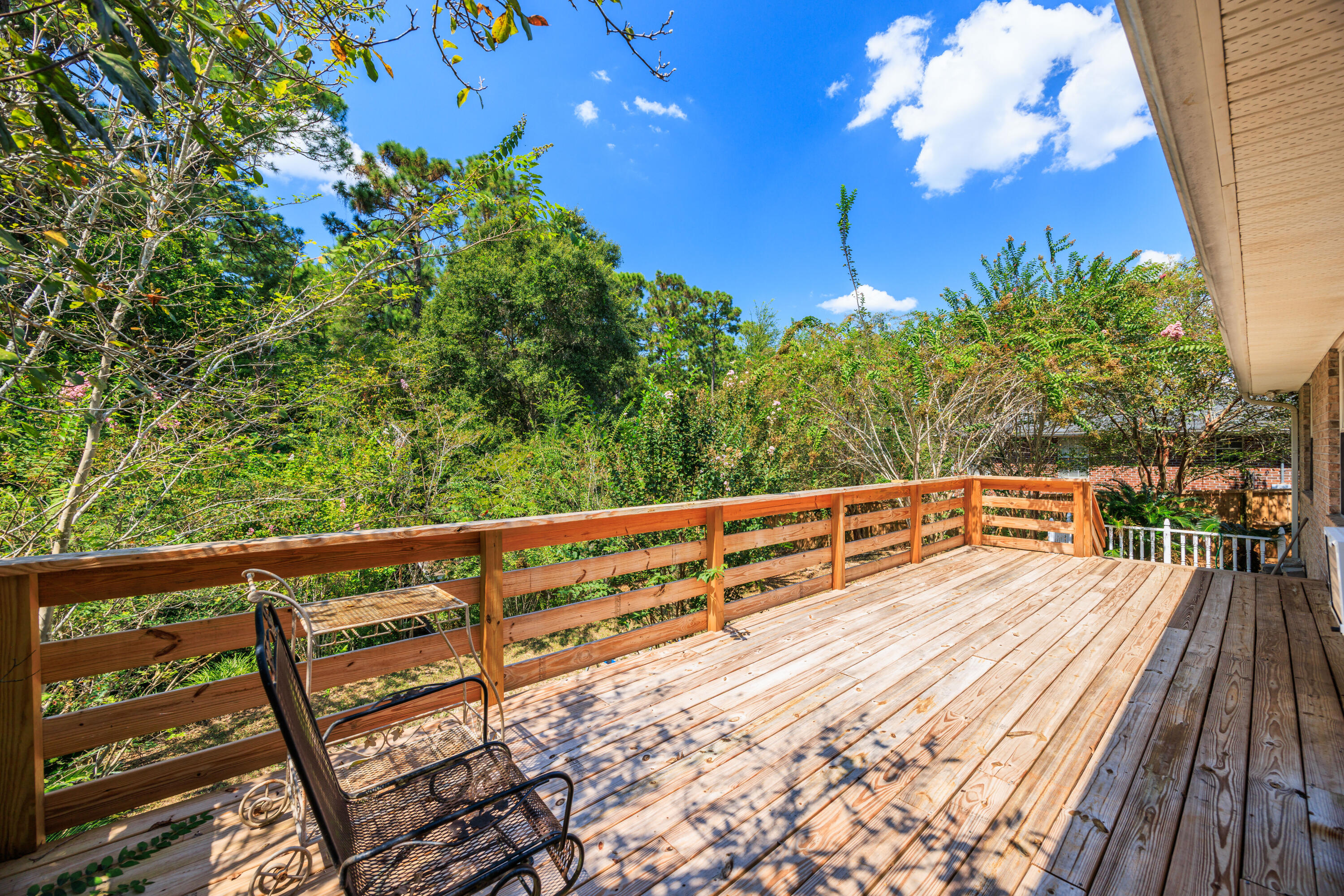 4860 Orlimar Street Crestview, FL 32536 - Photo 31 of 36 a view of a balcony with wooden stairs