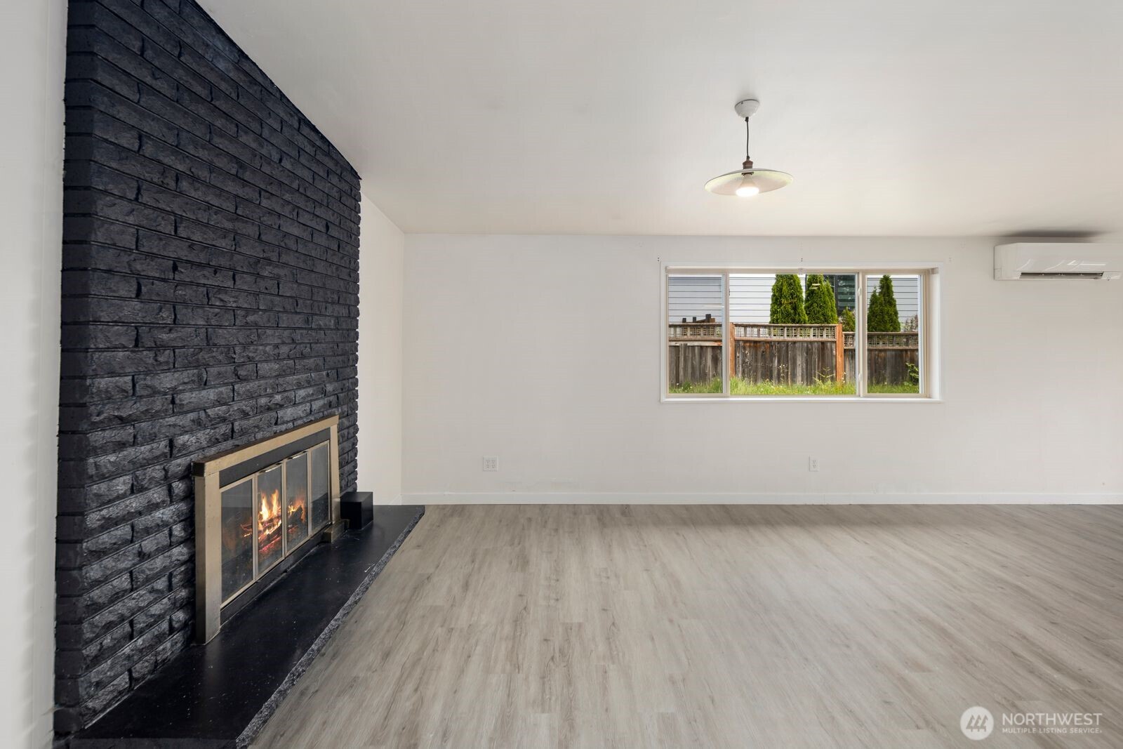 101 161st Street Southeast Bothell, WA 98012 - Photo 21 of 34 wooden floor in an empty room with a window