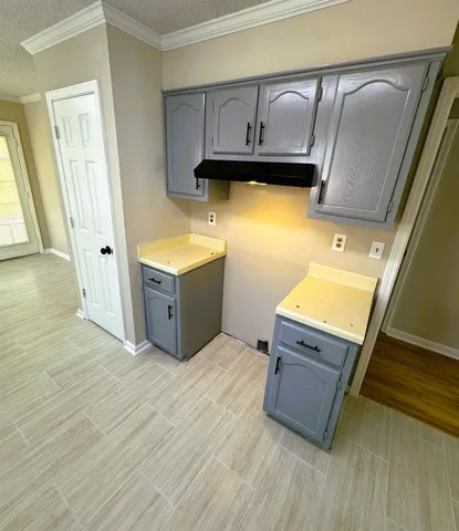 a room with wooden cabinets